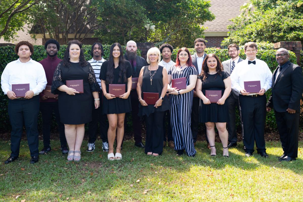 2022 Barbering Graduates from PRCC with Instructor