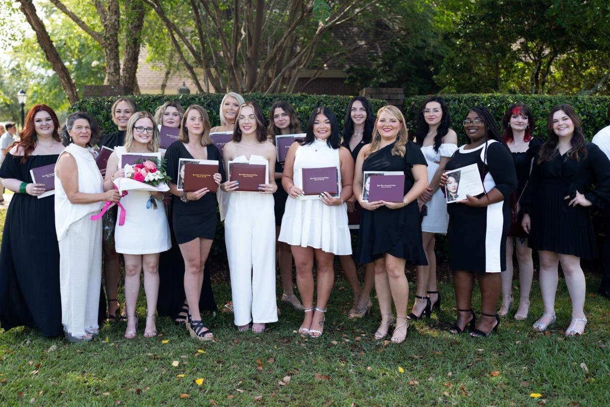 2022 Cosmetology Graduates from PRCC with instructor 