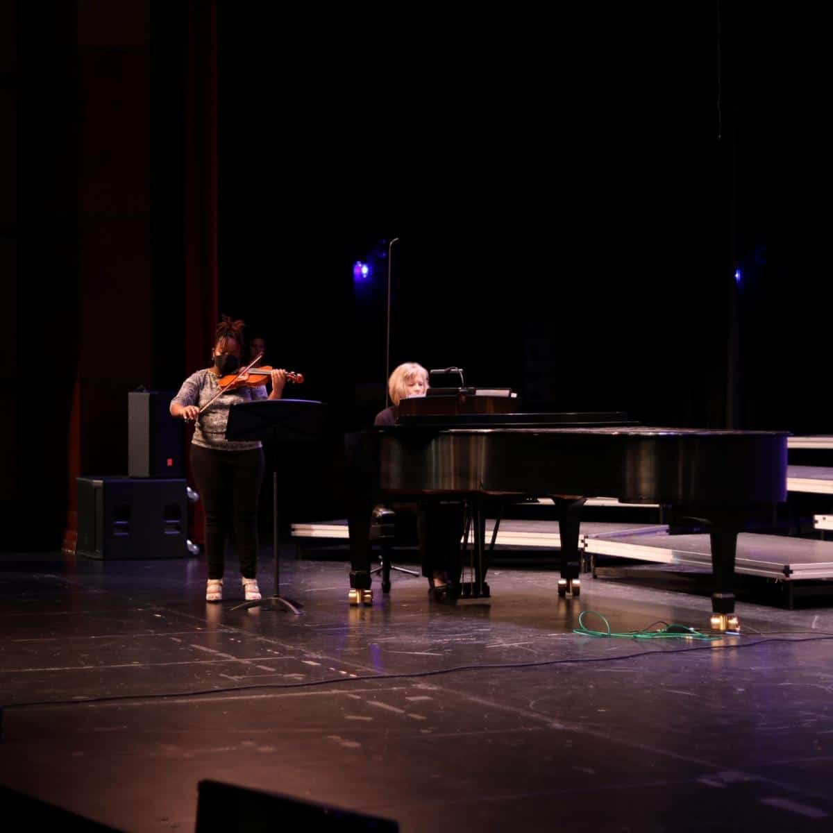 Alaysia Roberts performs while Mrs Hope Bass plays piano