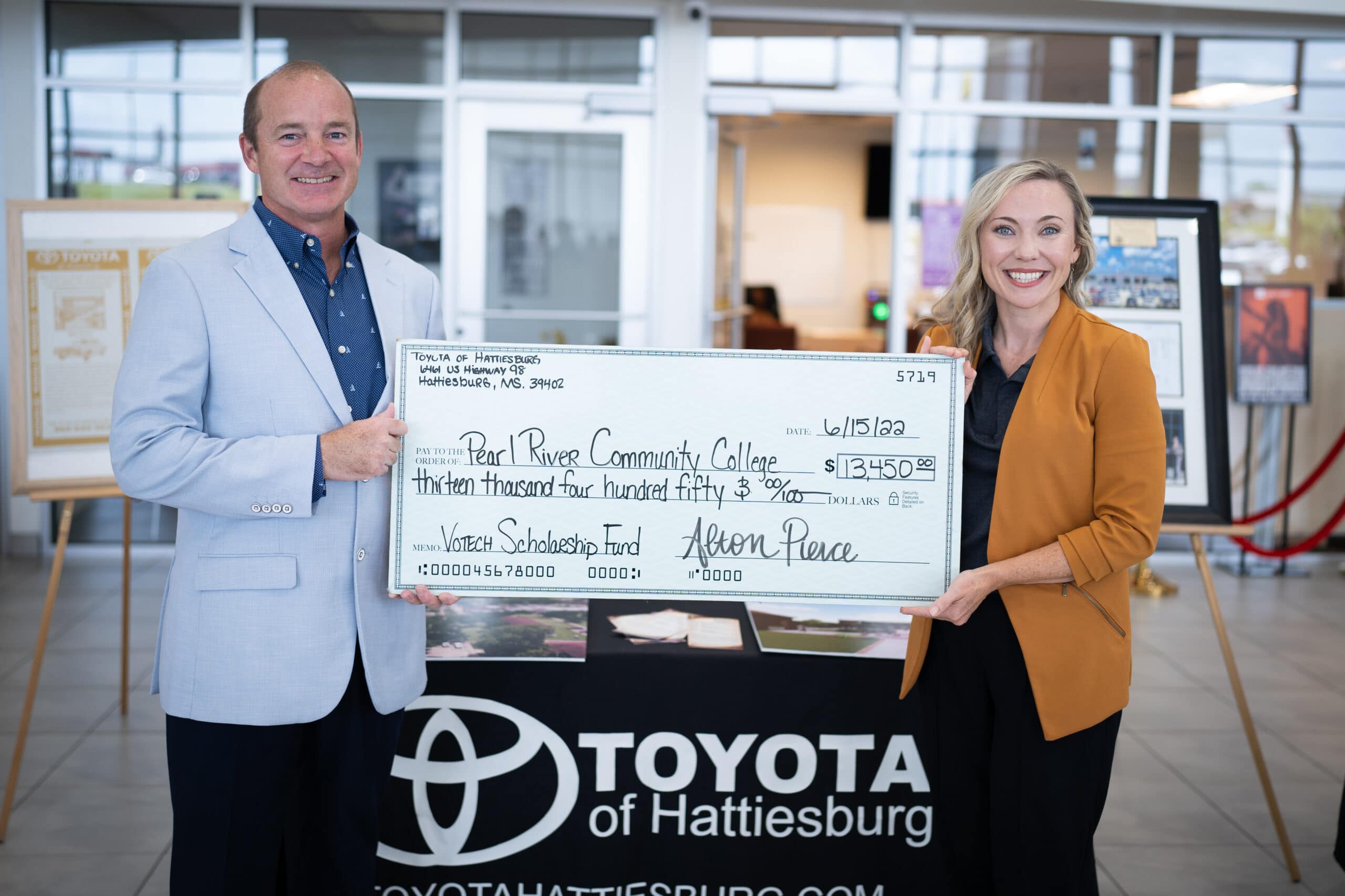 Alton Pierce from Toyota of Hattiesburg presents donation to Delana Harris of Pearl River Community College