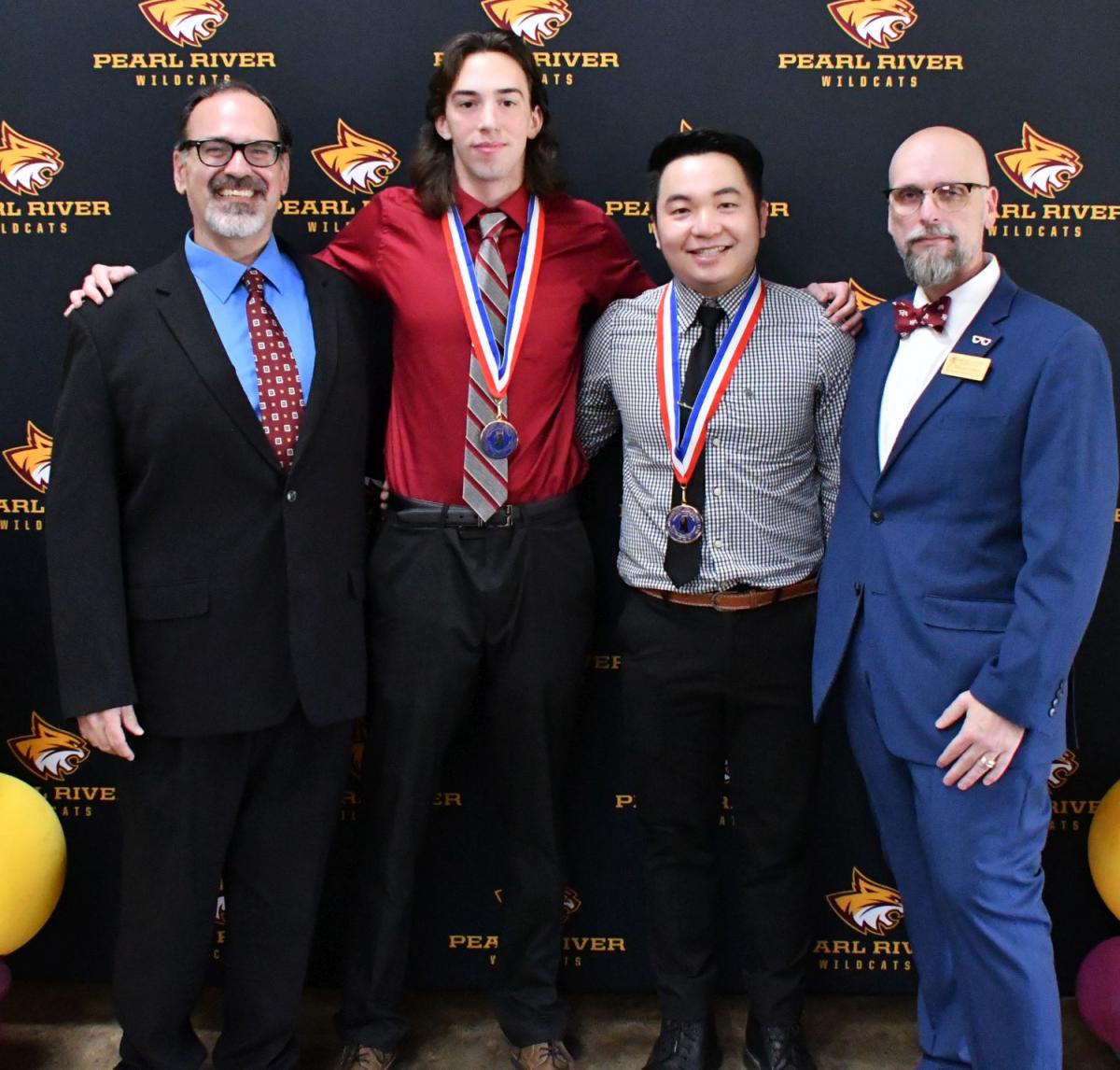 PRCC students Shui Lin of Fuzhou, Fujian Province, China and Patrick Dunkle of Petal were recognized as members of the All-Mississippi Academic Team. They are pictured with Dr. Doug Donohue (right) and Dr. James Collum, Phi Theta Kappa advisors.