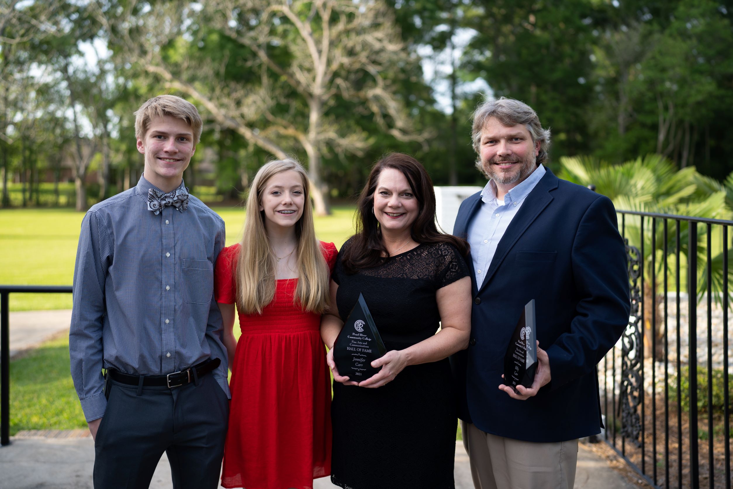 Billy and Jennifer Carr with their children and their Fine Arts Hall of Fame awards 2022