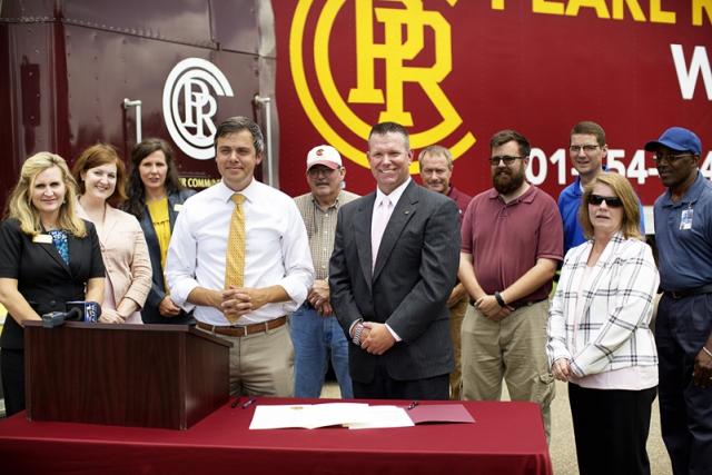Toby Barker, Mayor of Hattiesburg, and PRCC President, Dr. Adam Breerwood, announce a partnership between the City of Hattiesburg and PRCC providing CDL training for city employees. They are joined by other PRCC representatives and city officials.