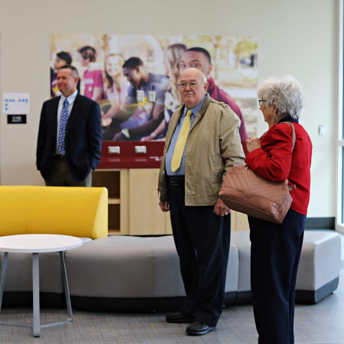 Former PRCC History Instructor Mr. Walt Lowe and his wife Myra Lowe admire the new interior of Seal Hall where he taught. PRCC President Dr. Adam Breerwood stands in the background. 