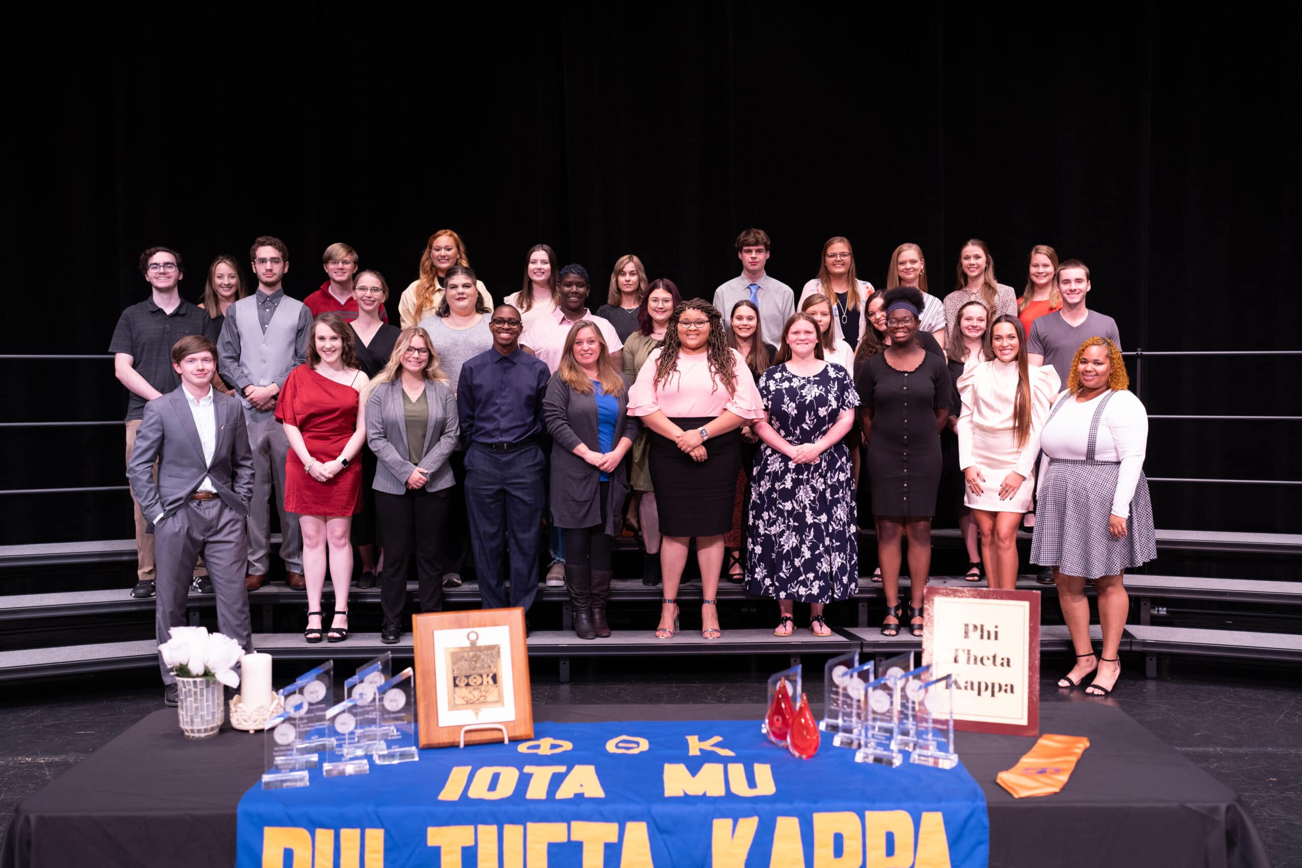 PRCC Iota Mu Chapter of PTK Fall 2021 Induction Students on stands