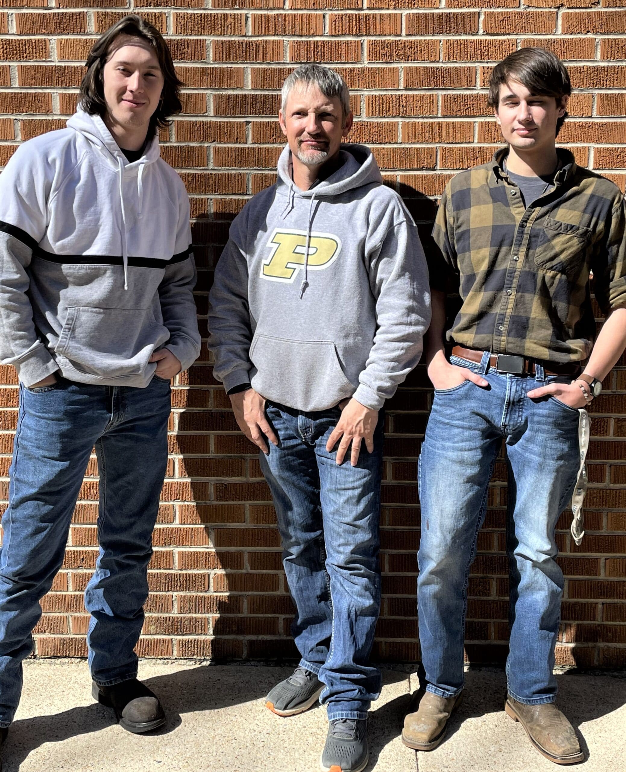 Pearl River Community College students Mitchell Greer (left) and Thomas Bush (right), pictured with instructor Robby Shaw