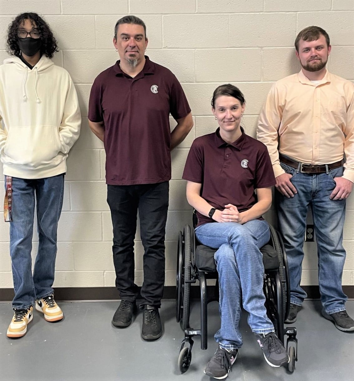 Pearl River Community College students Sungjin Farris (left) and Joshua Loper (right), pictured with instructors Dustin Chambliss and Sam McNease