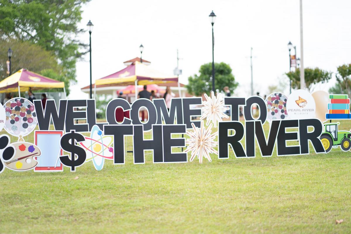 Welcome to the River signage constructed by Sign Gypsies of Pearl River