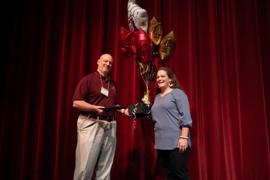 Lonnie Burchell presented with Outstanding PRCC Employee Award by Hannah Miller