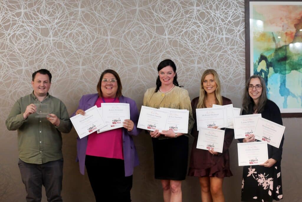 One man and four women hold certificates